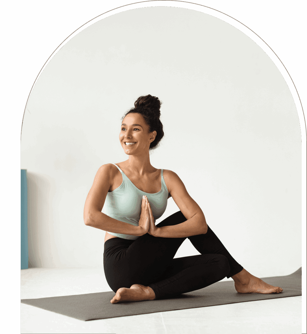 Smiling woman in seated yoga pose