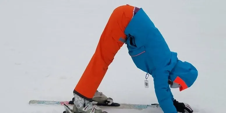 Colorful ski outfit in snowy landscape
